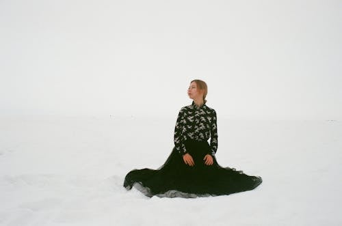 Woman Wearing Black and White Floral Long-sleeved Dress