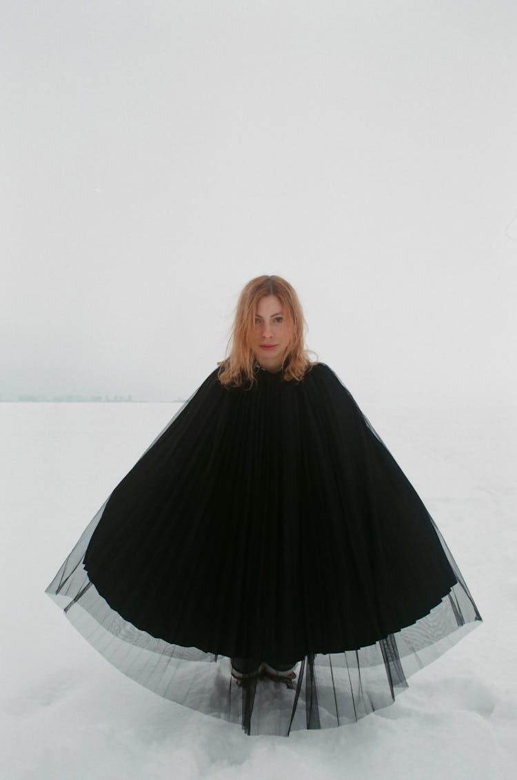 Woman Wearing Black Poncho