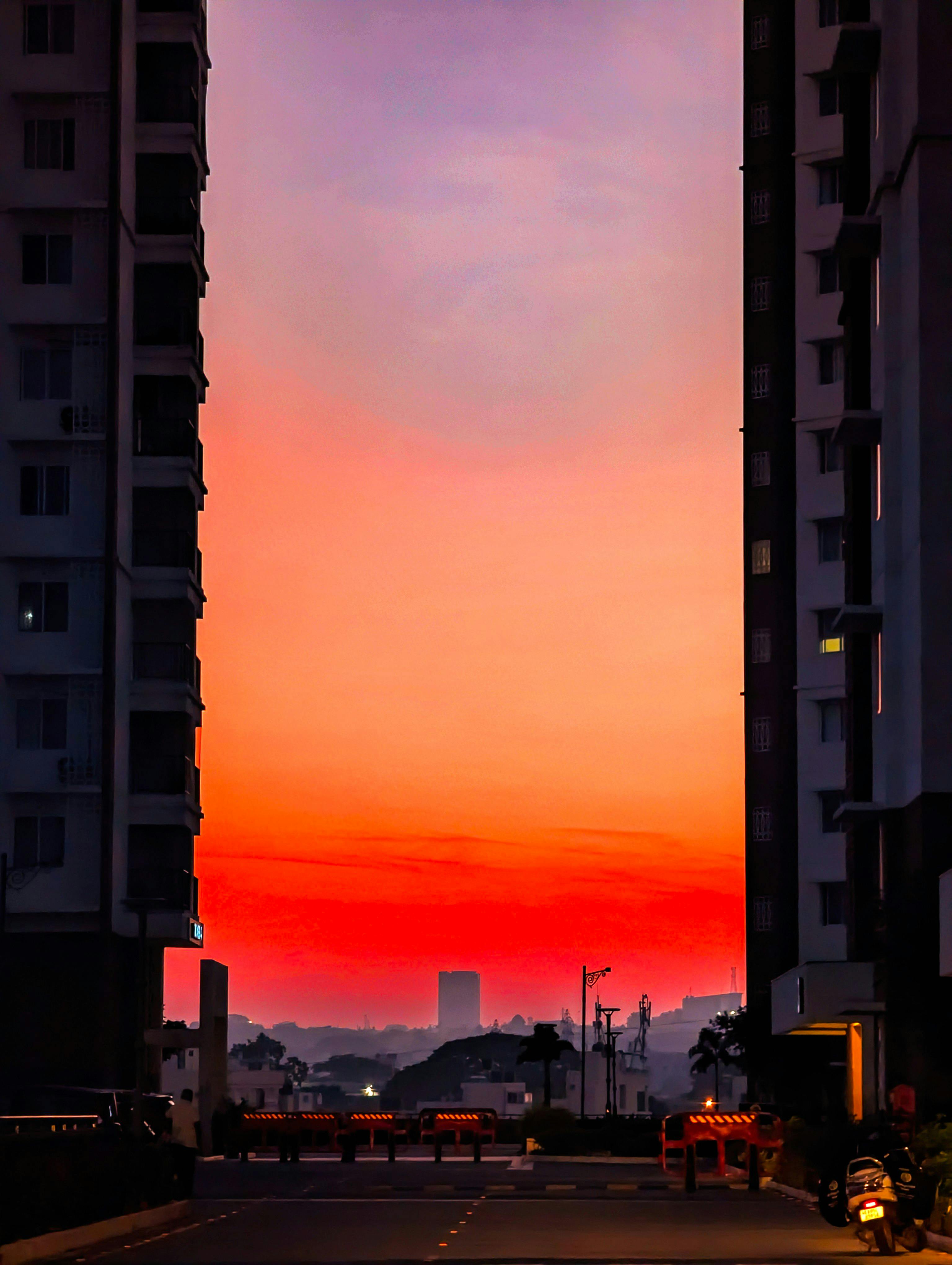 vibrant urban sunrise between tall buildings