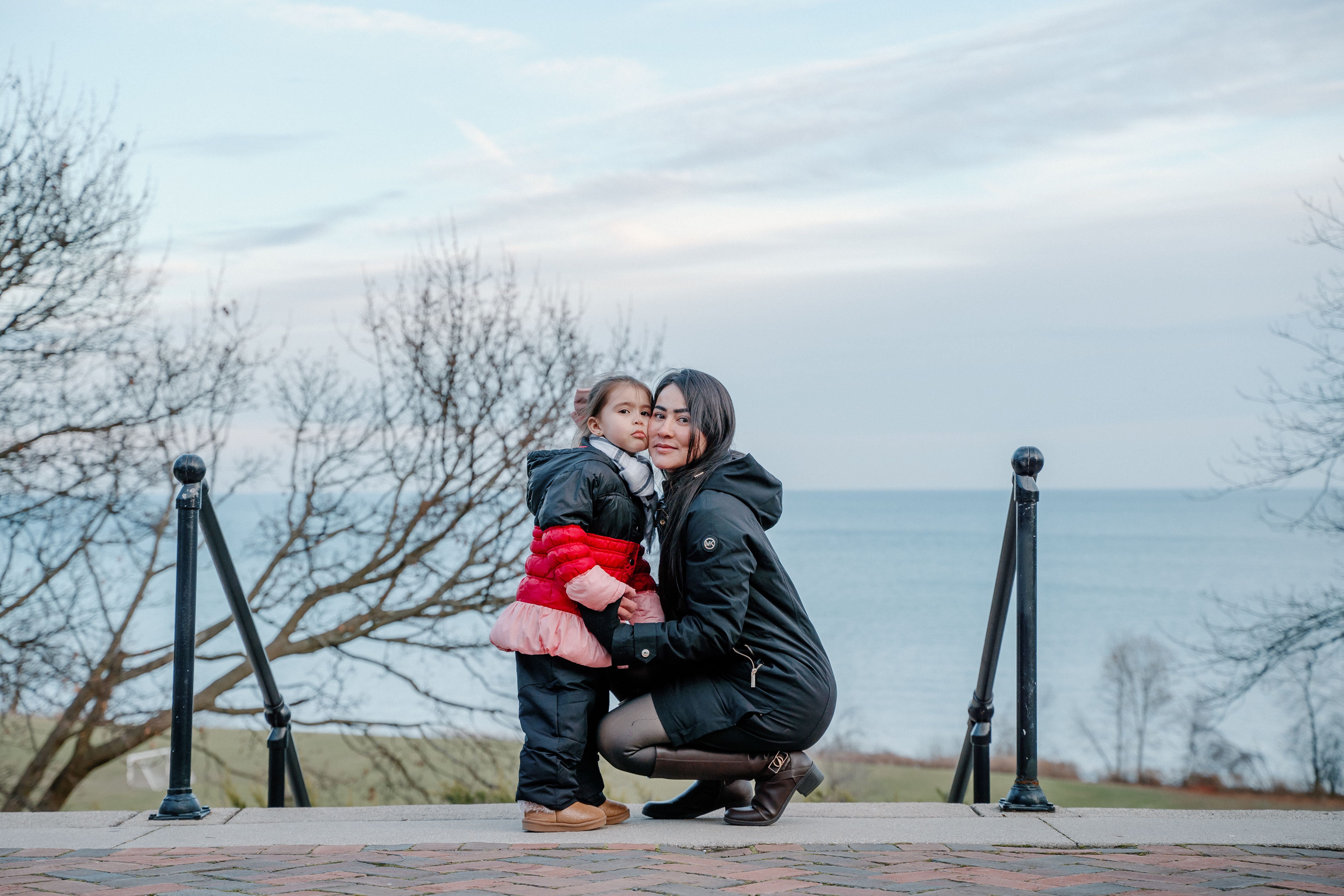Mother and Daughter by Lake Michigan in Winter · Free Stock Photo