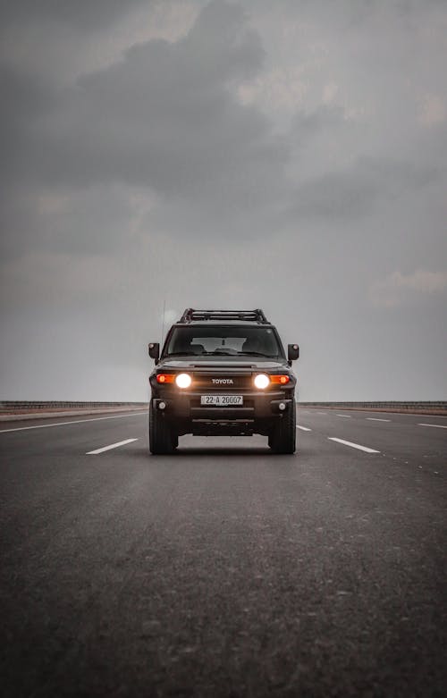 Free Front view of a Toyota SUV driving on a highway in Erbil, Iraq, during the day. Stock Photo
