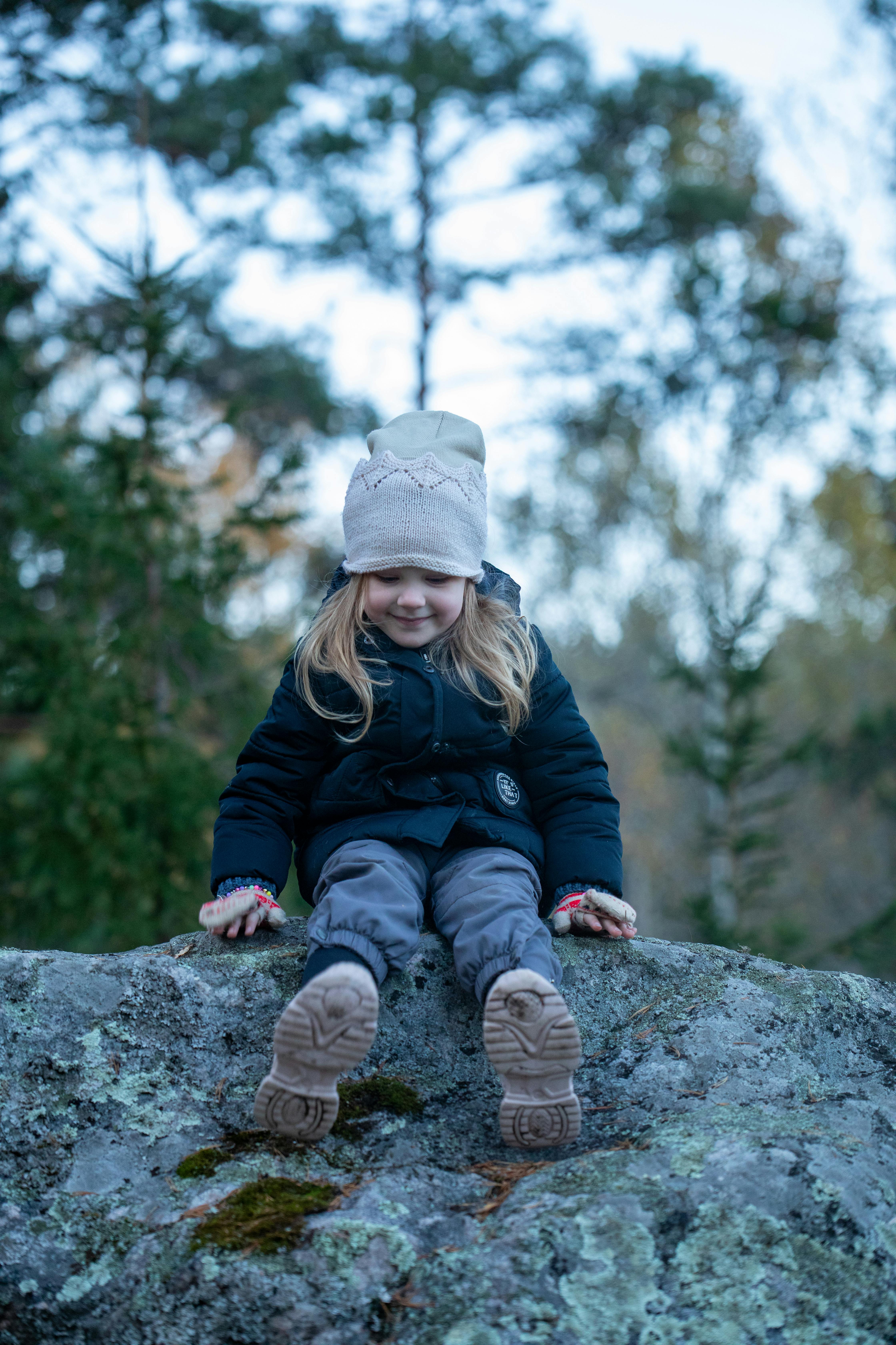 child enjoying nature on a cool autumn day