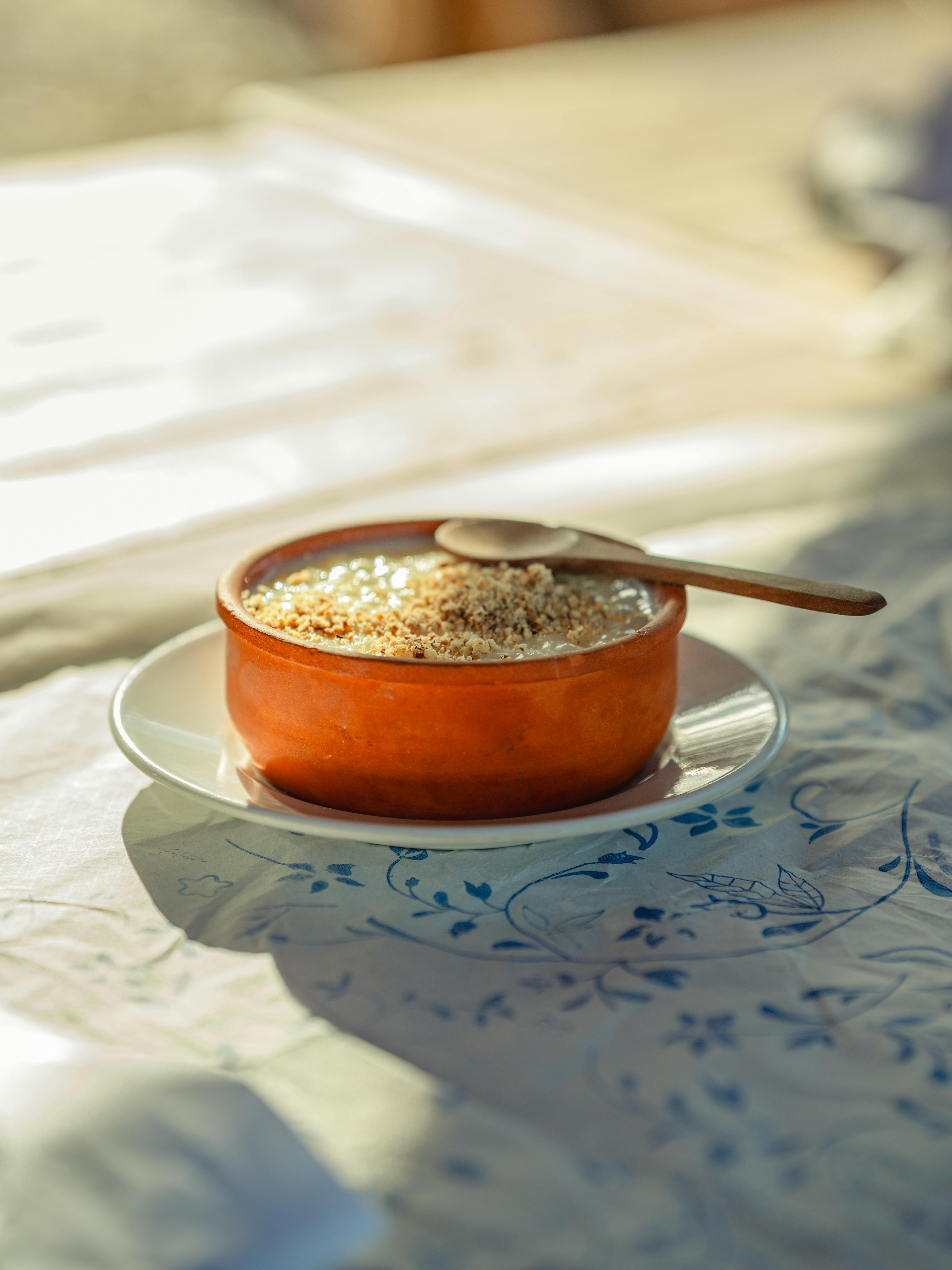 rustic ceramic bowl with porridge outdoors