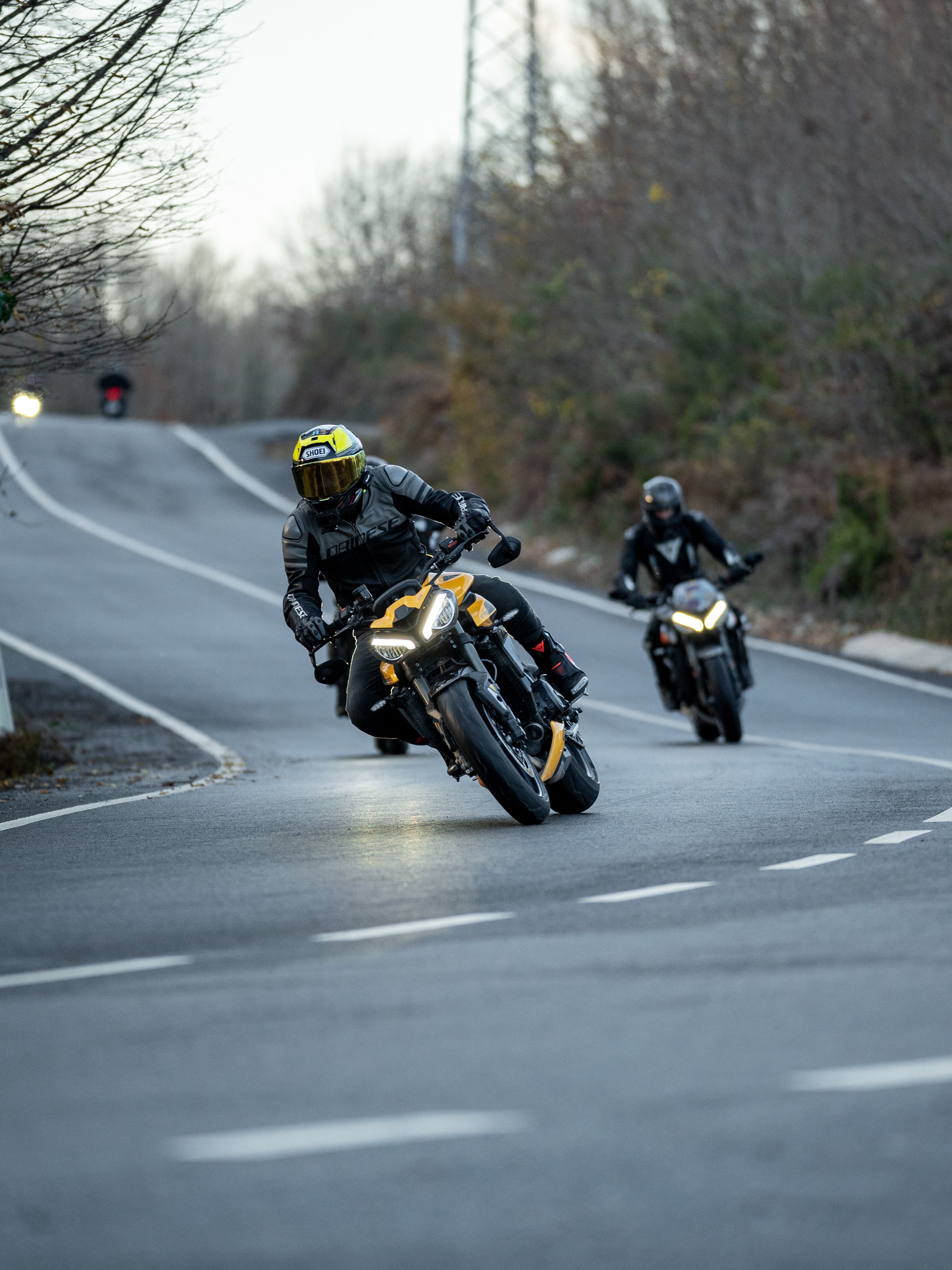 Dynamic Motorcycle Racing on Countryside Road · Free Stock Photo