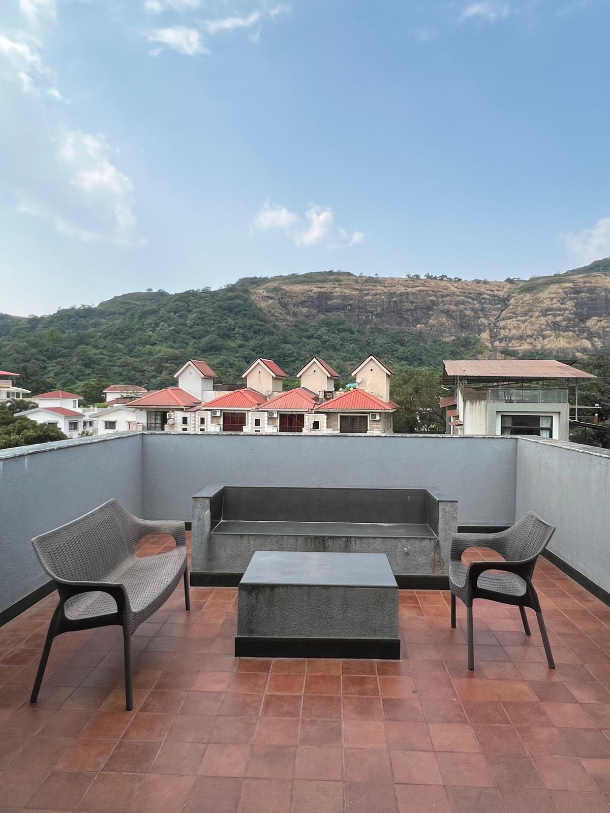 Rooftop seating area with mountain view and durable deck surface