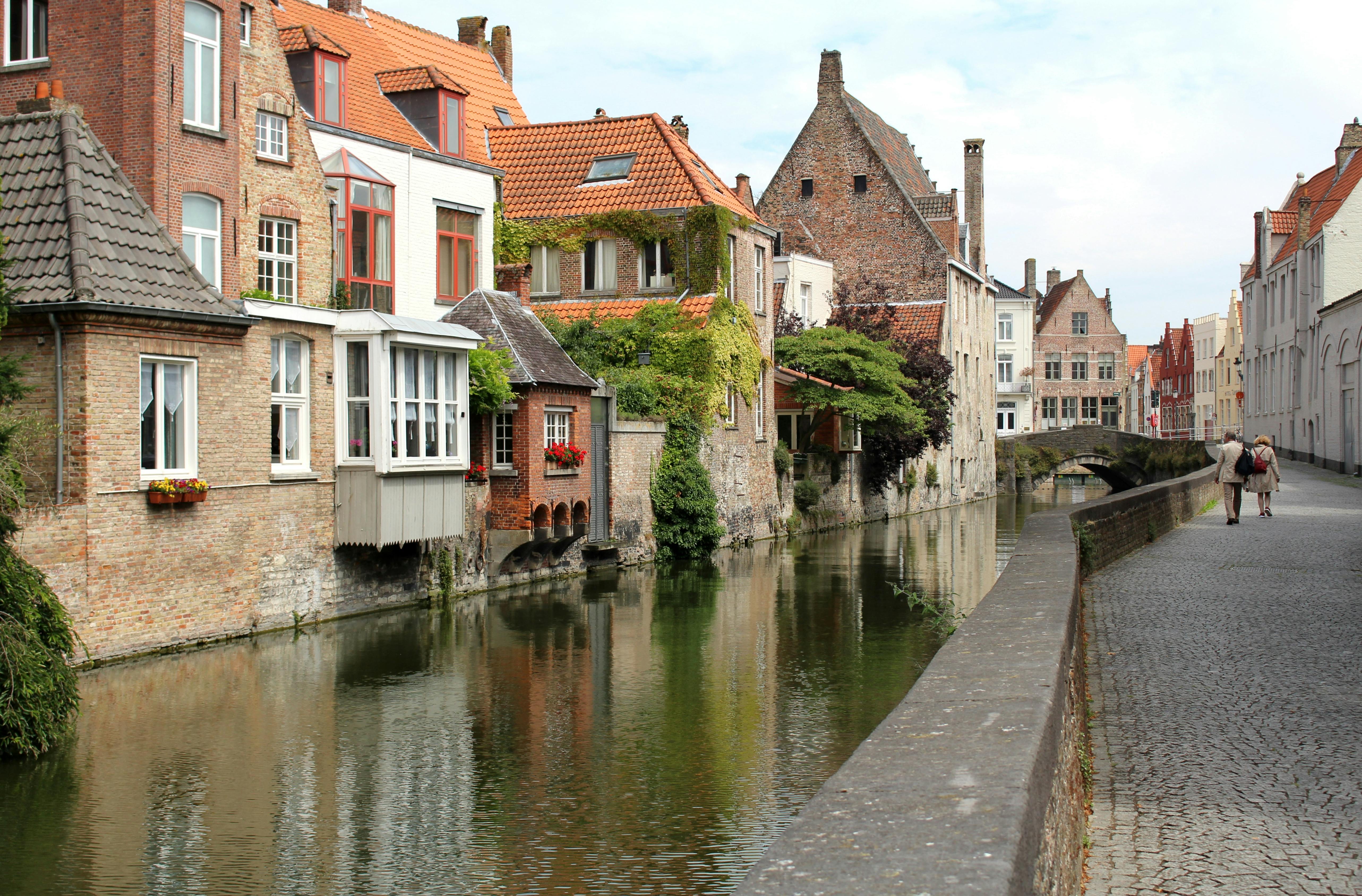 Picturesque view of a canal and historic buildings in Bruges, Belgium.