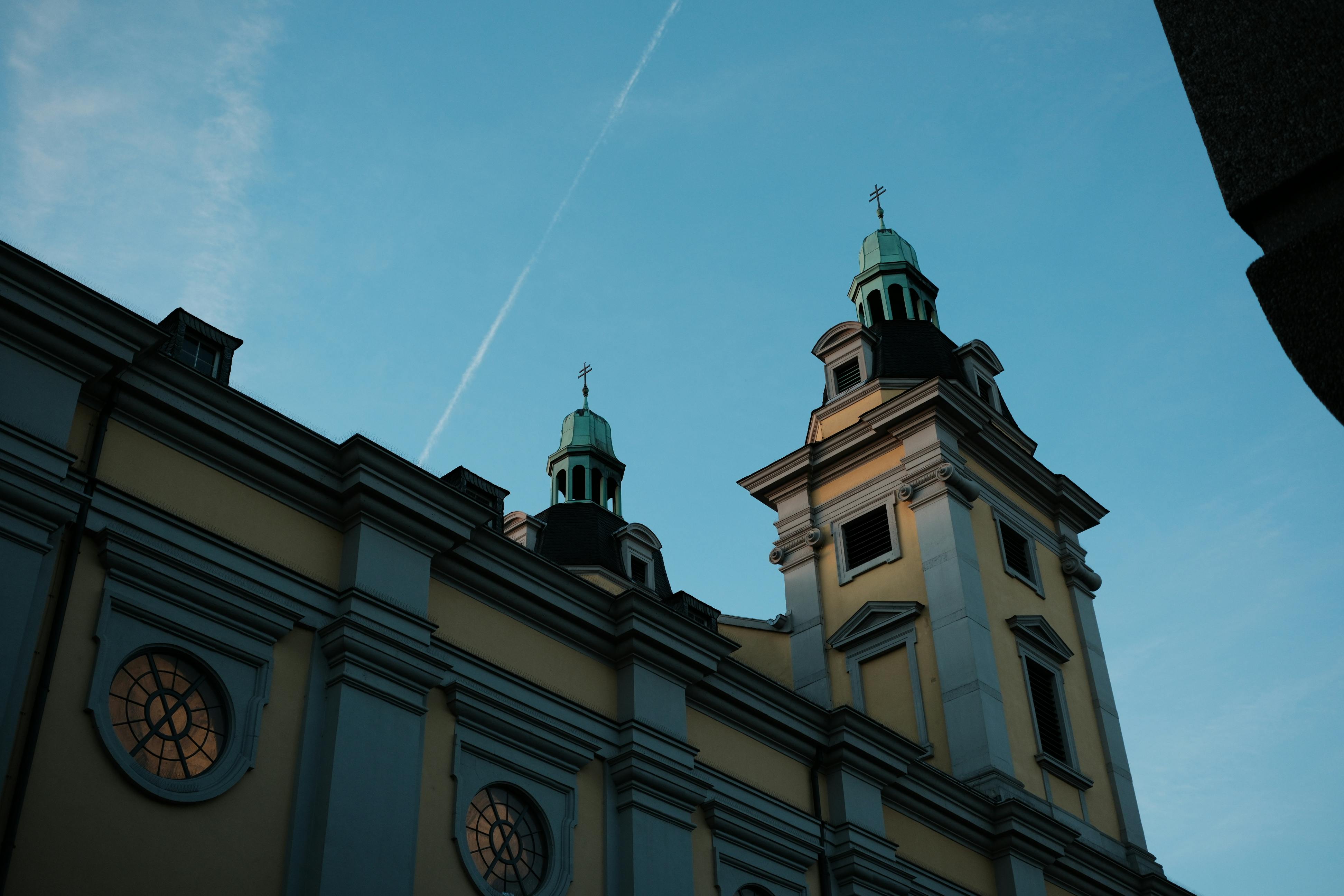 historic church towers under clear blue sky