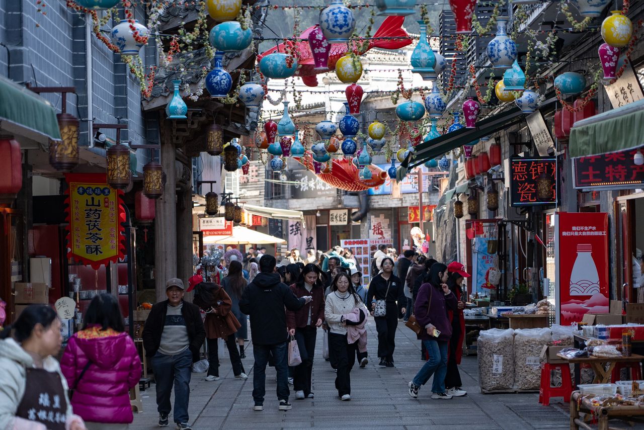 vibrant market street adorned with colorful lanterns and bustling with