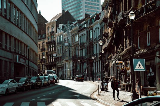 Explore a bustling Brussels street lined with classic European architecture.