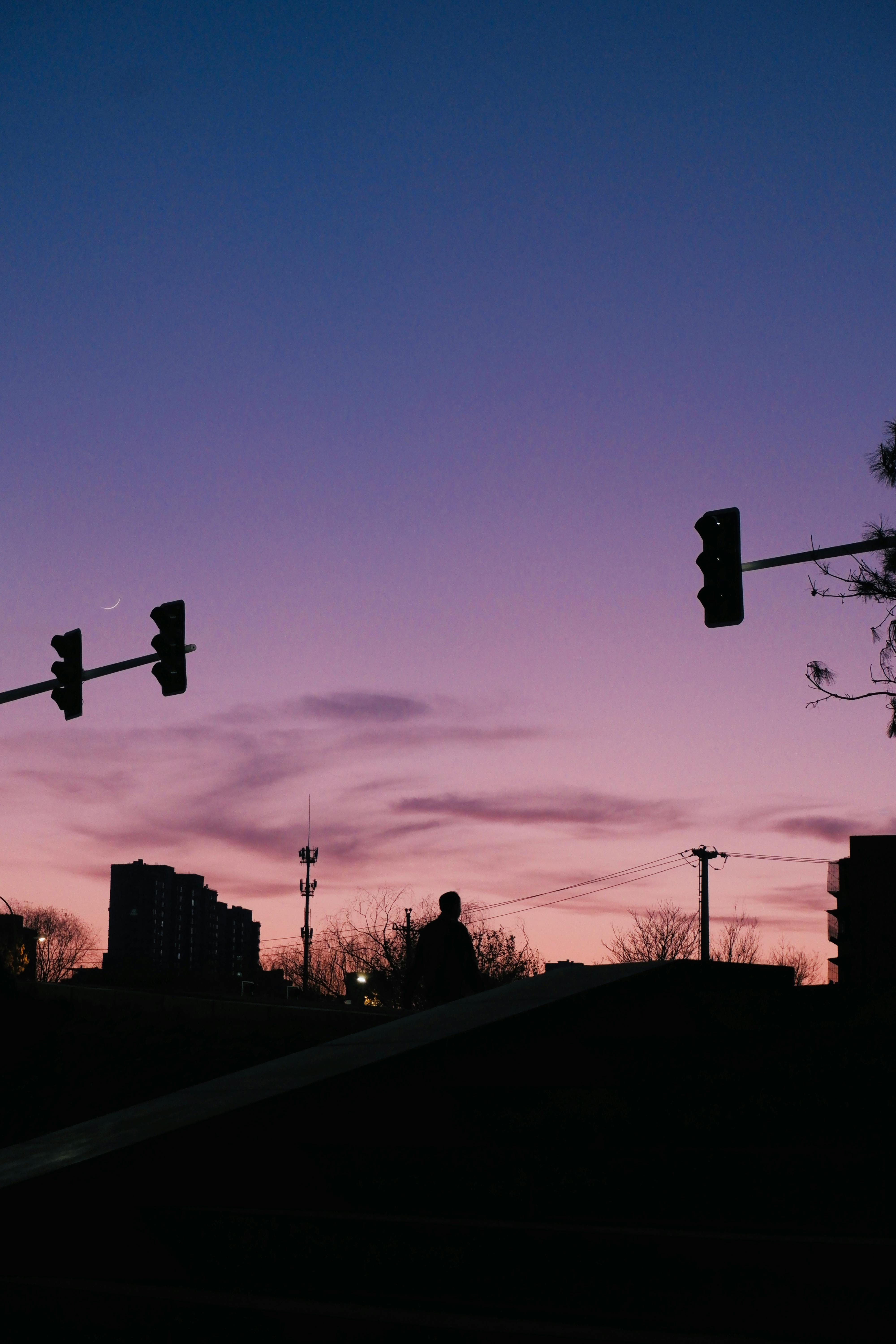 Silhouette of Cityscape at Dusk with Traffic Lights · Free