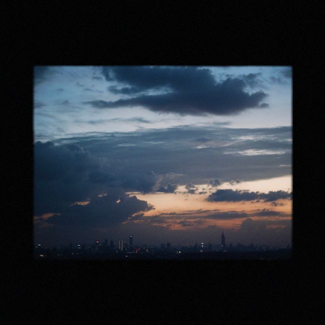 Silhouette of city skyline with an awe-inspiring, dramatic sunset sky.