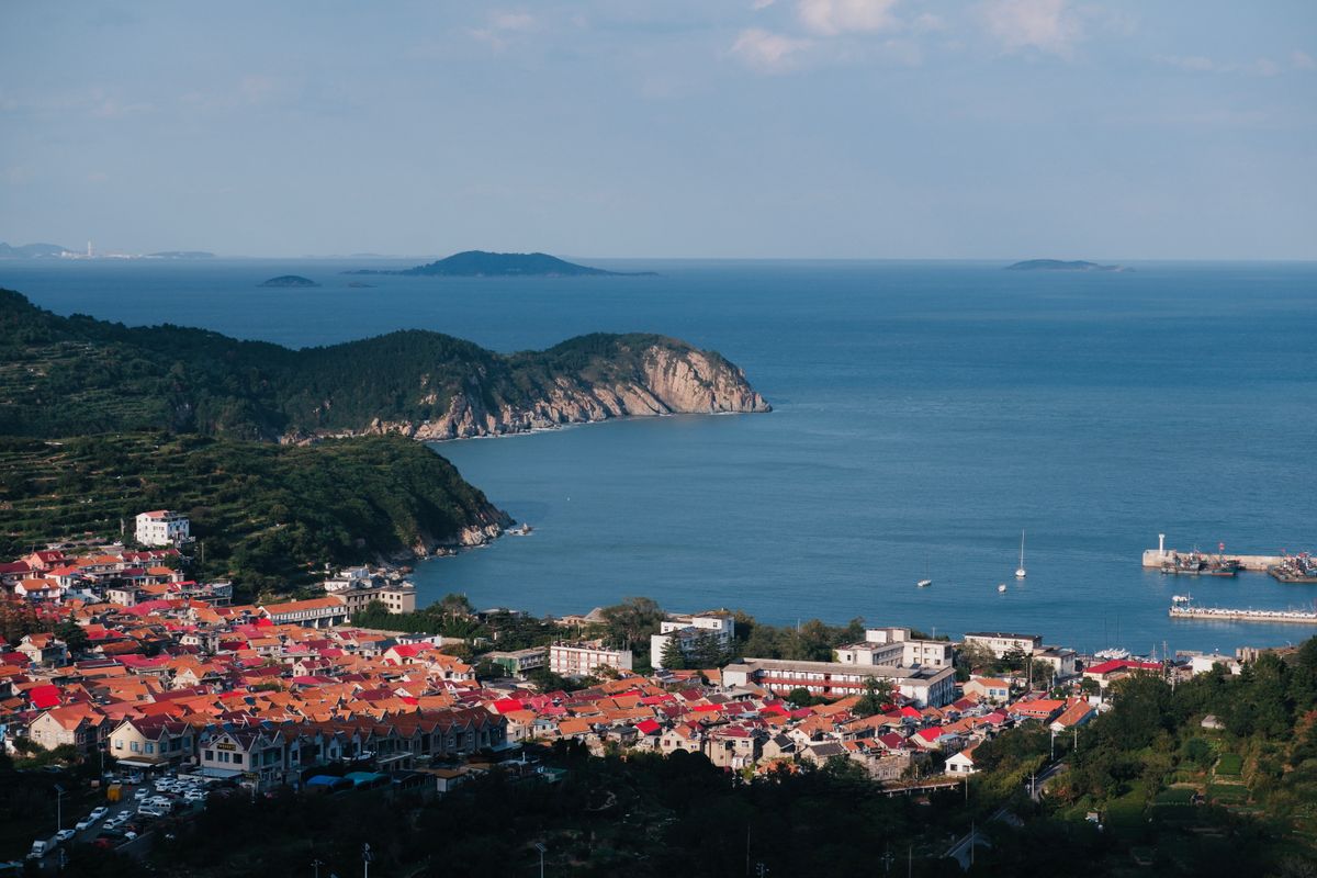 Red-roofed coastal houses overlooking the sea