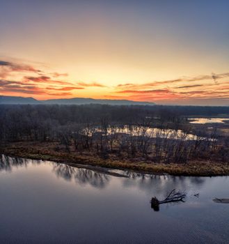 Serene aerial view of sunset over the Mississippi River in Kellogg, Minnesota highlighting the tranquil waters and scenic landscape.