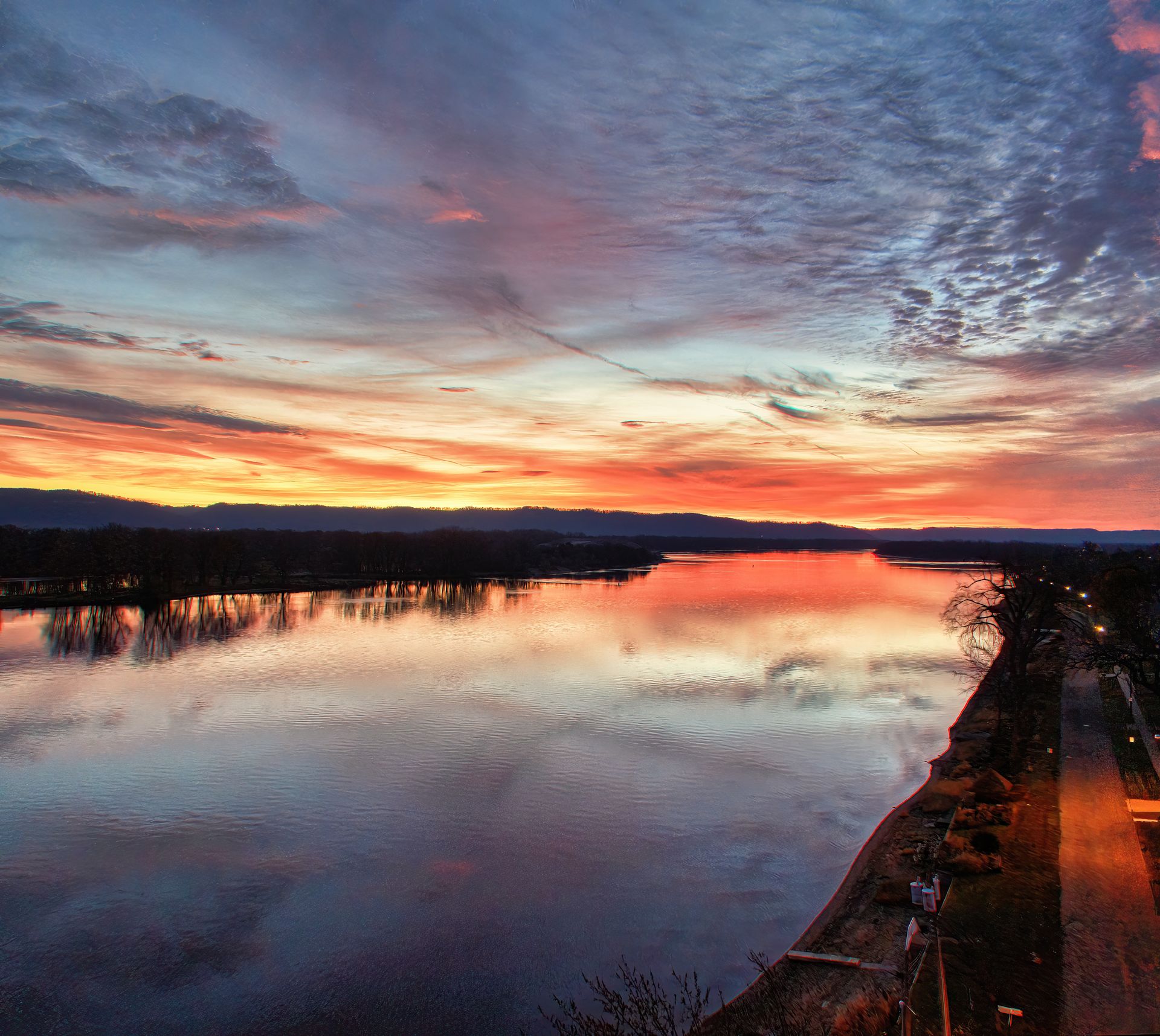 Breathtaking sunset over the Mississippi River with vibrant sky reflections in Wabasha, Minnesota.