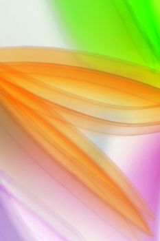 Vibrant abstract image with soft colorful light streaks creating a dynamic and ethereal effect.