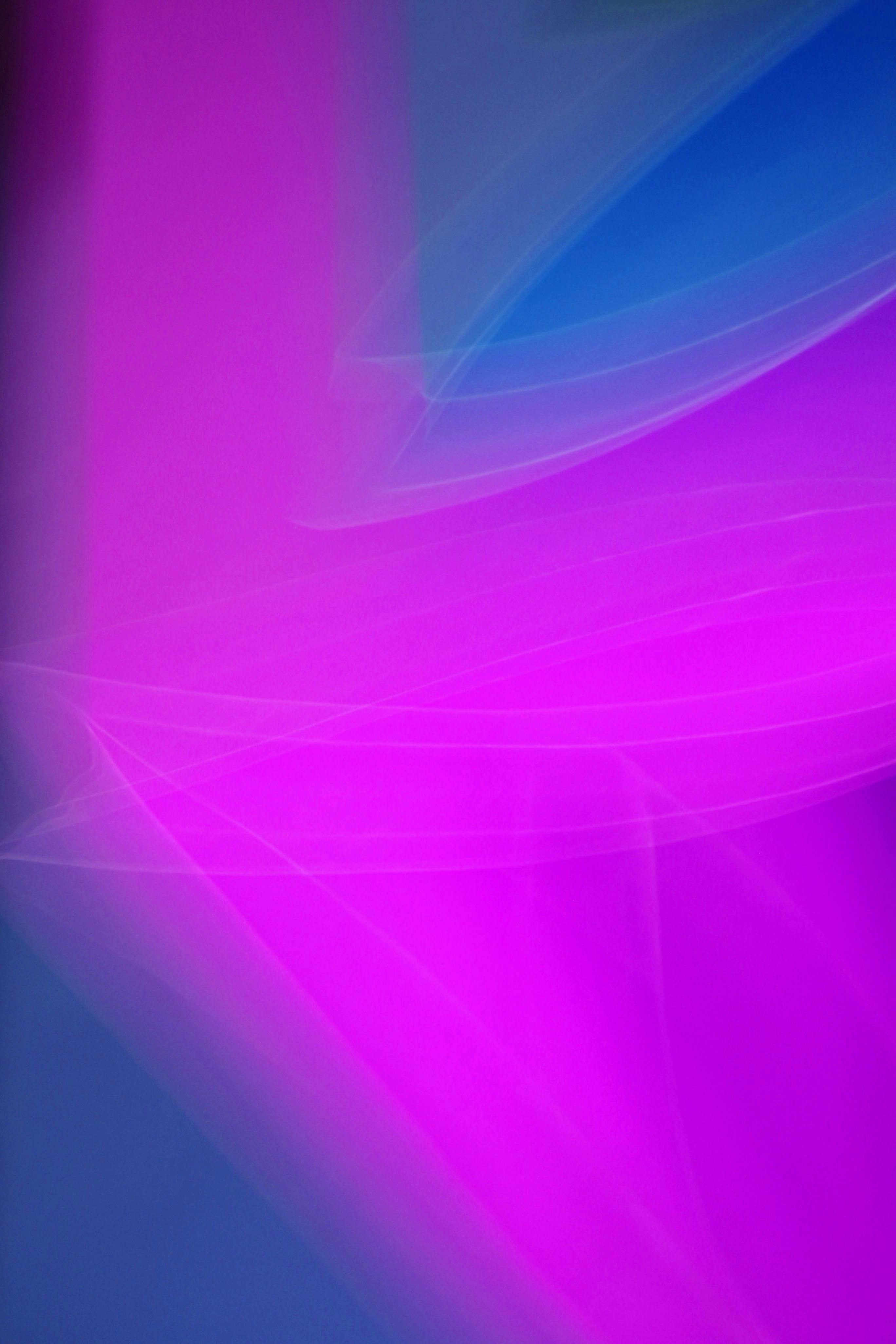 Free Captivating abstract image of dynamic pink and blue light trails creating a modern art effect. Stock Photo