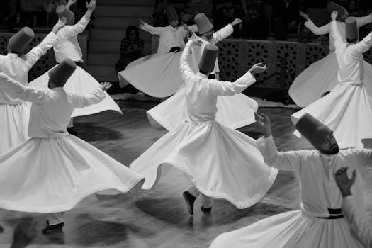 Black and white photo of whirling dervishes performing a traditional Sufi dance.