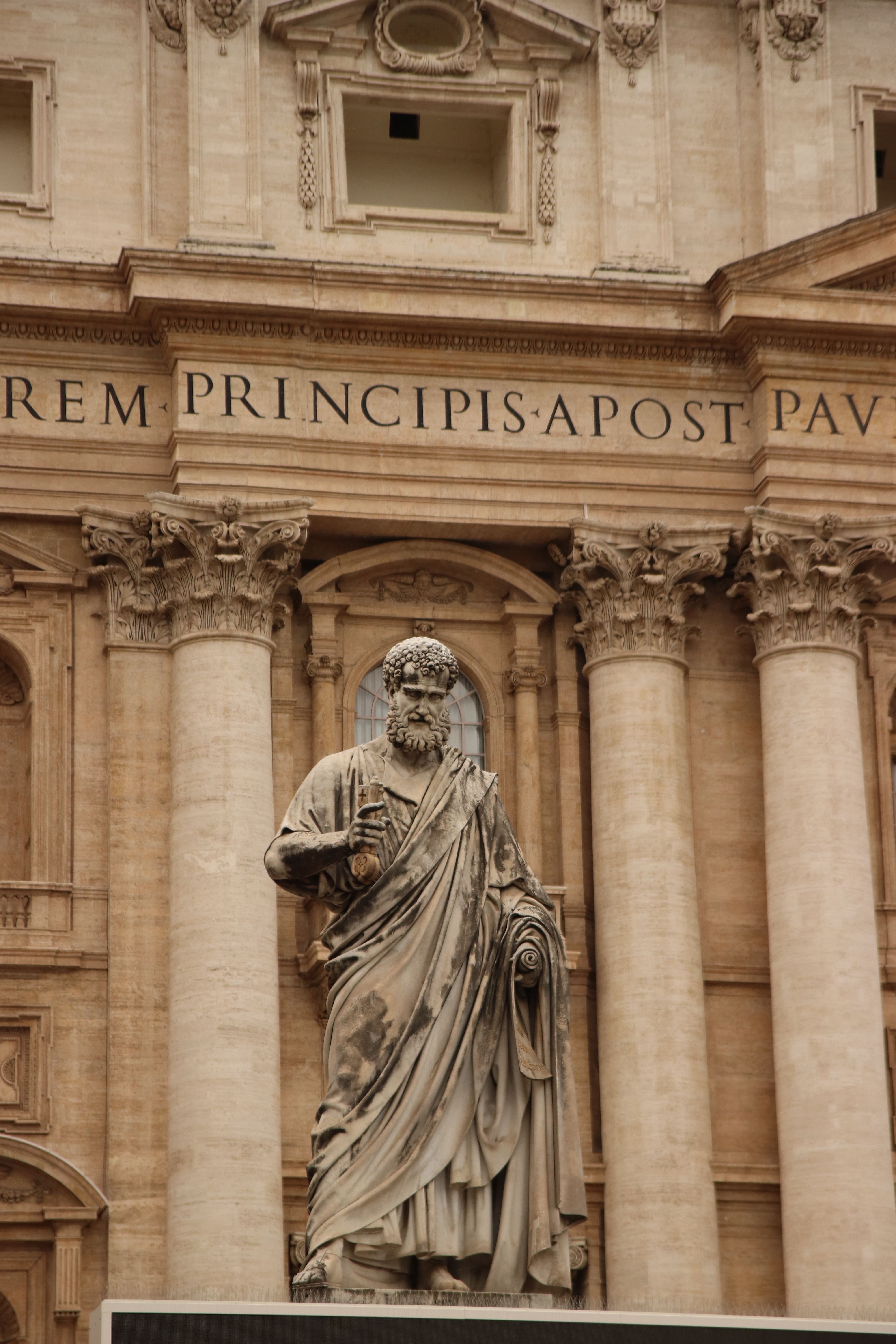 Intricate statue of Saint Peter at St. Peter's Basilica showcasing baroque architecture.