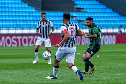 Dynamic soccer match scene with players competing for the ball on a professional field.