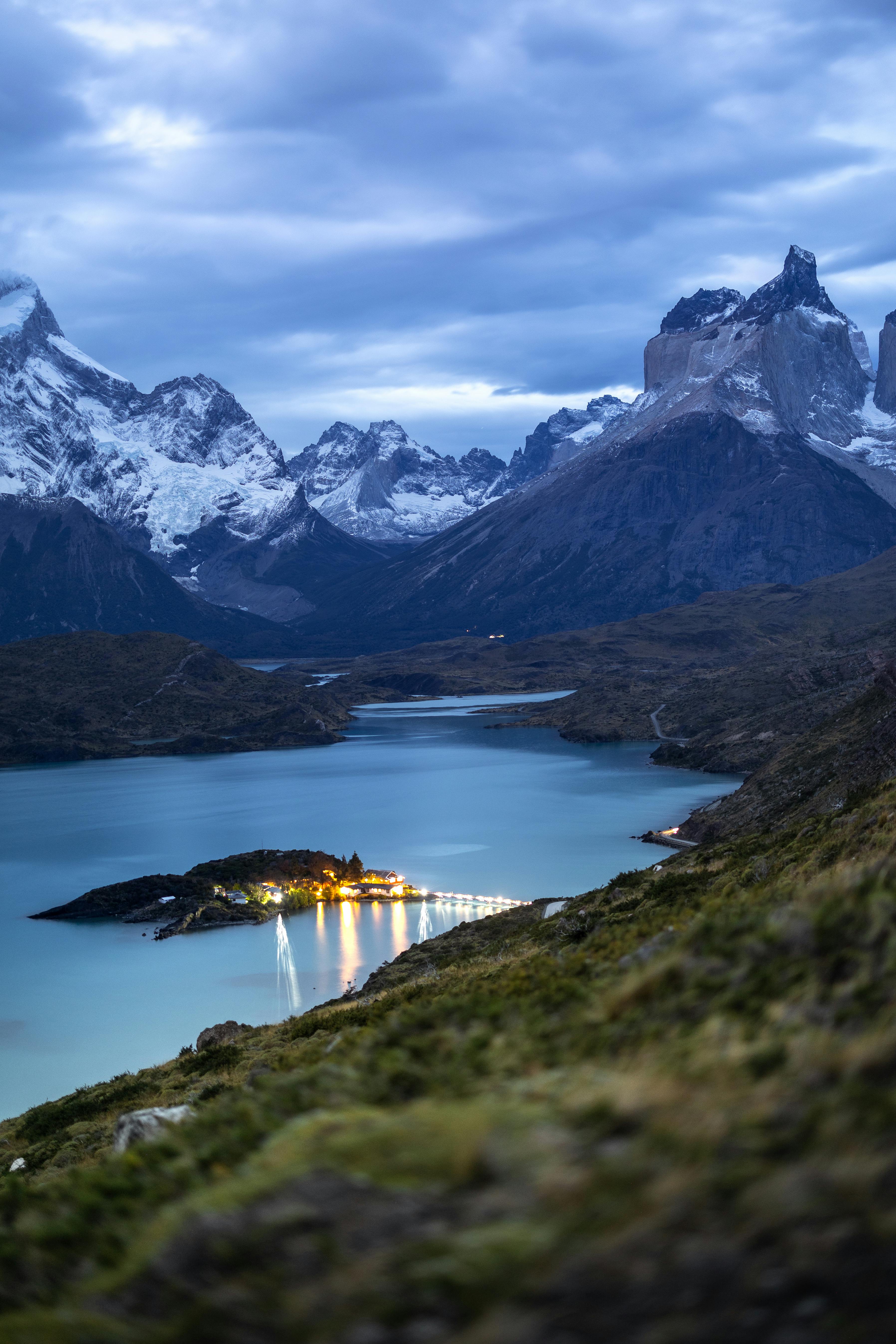 Captivating twilight landscape of Torres del Paine, overlooking lake and mountains in Chile.