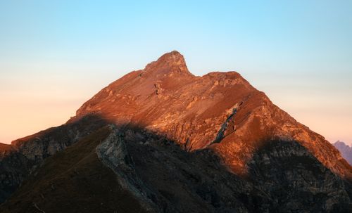 Free A breathtaking view of Aosta Valley mountains at sunset, showcasing natural beauty. Stock Photo