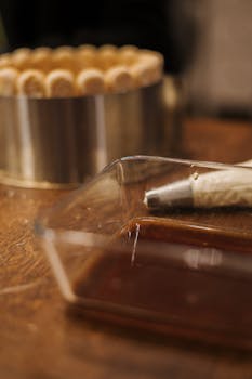 An inviting scene of homemade cake preparation with ingredients and baking tools.