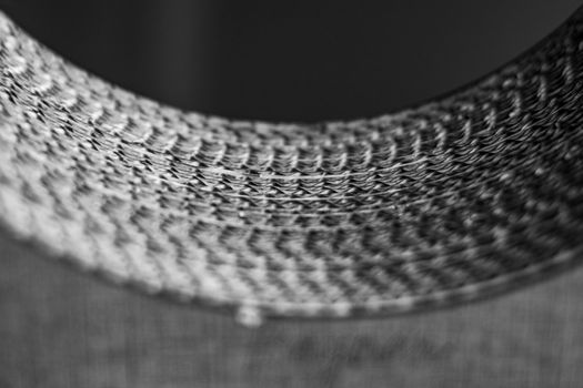 Intricate black and white close-up of woven texture, highlighting depth and pattern.