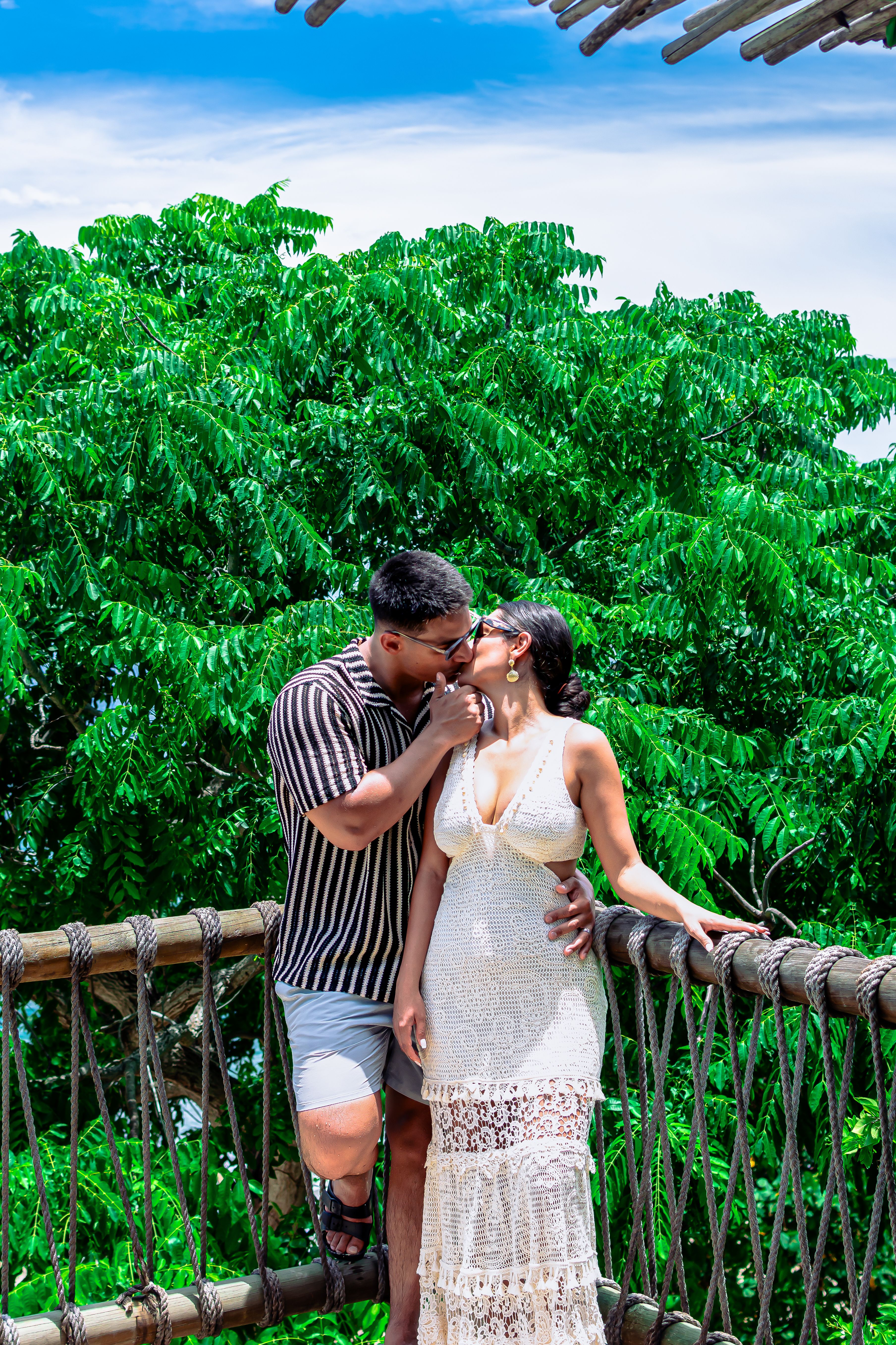 Romantic Couple Sharing a Kiss on a Sunny Day · Free Stock Photo