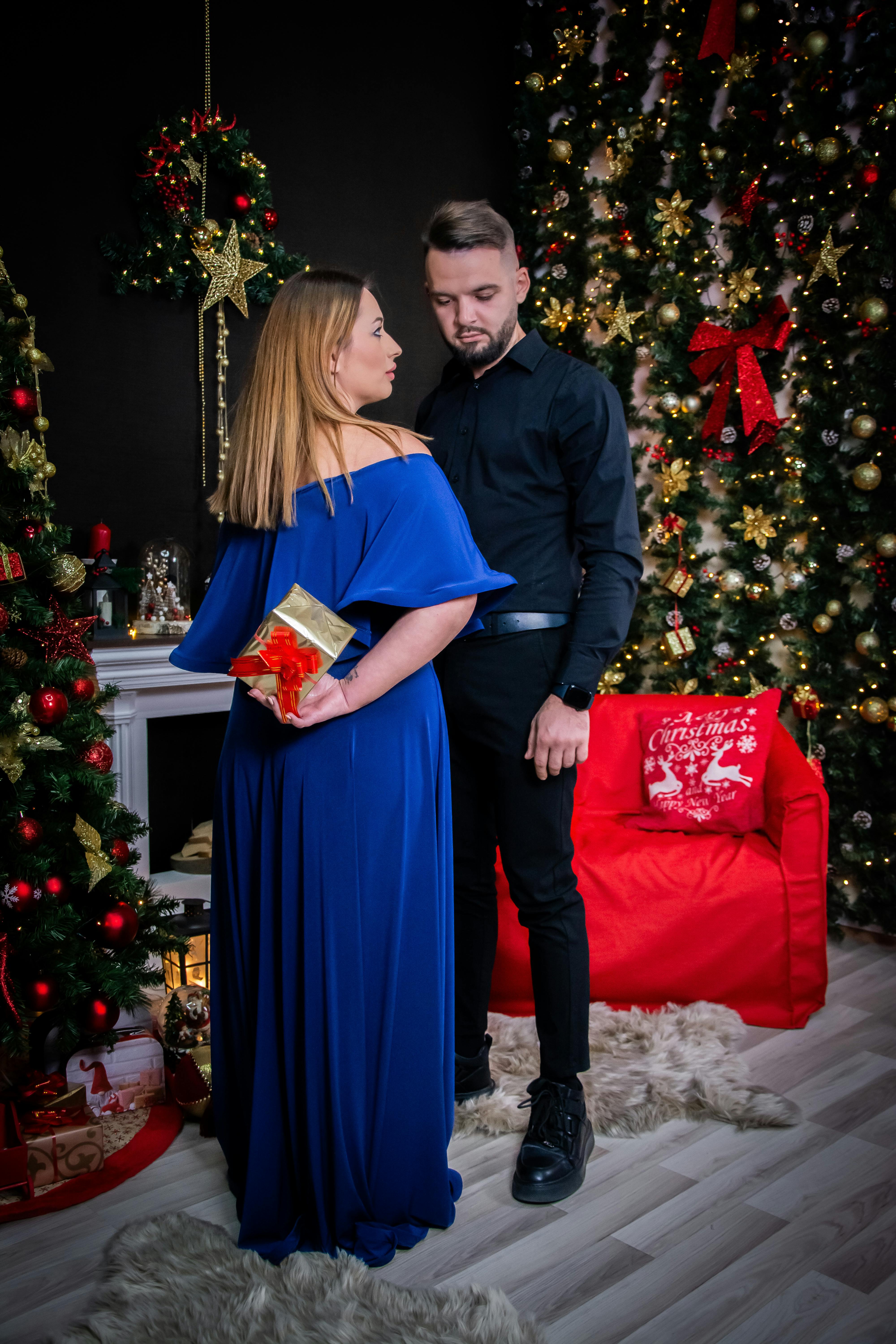 elegant couple celebrating christmas at home