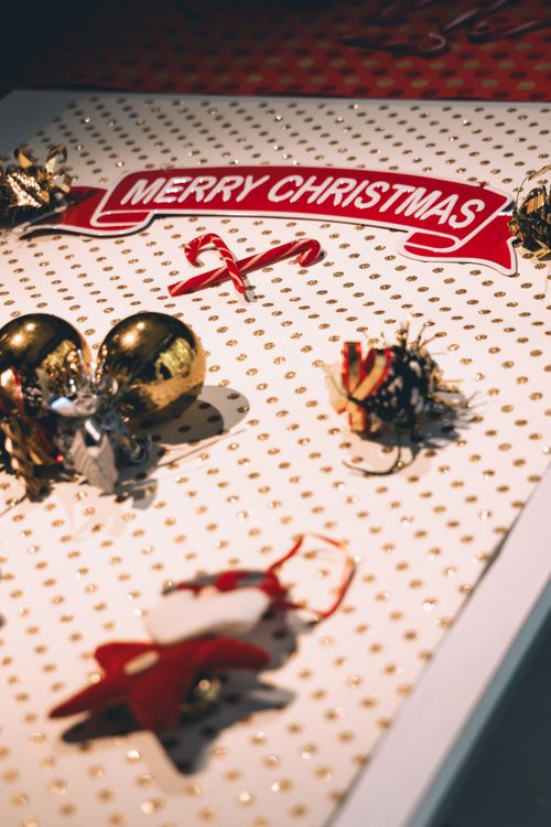 Free A flat lay of Christmas decorations including baubles and candy canes in Ciudad de México. Stock Photo