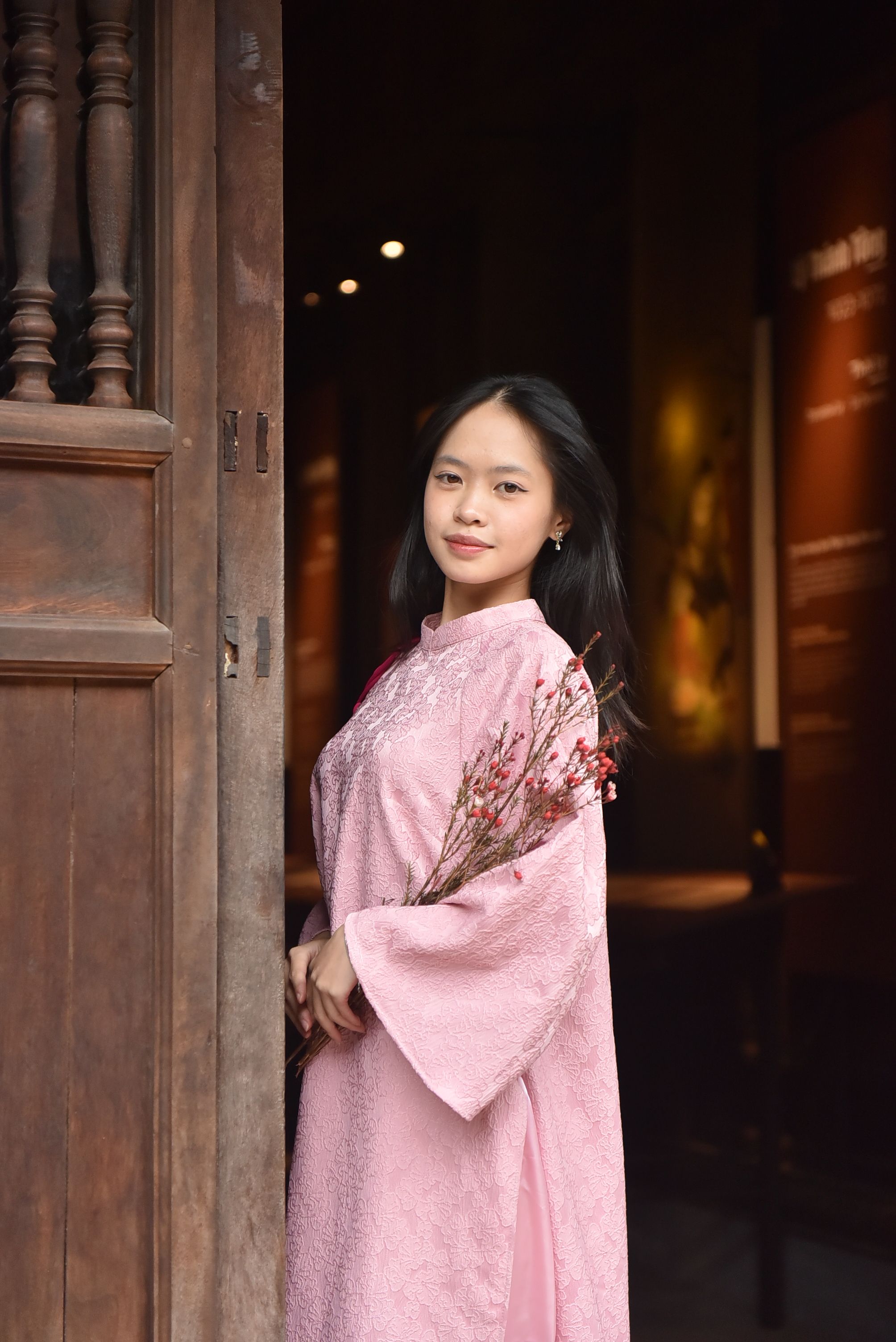 Elegant Woman in Traditional Pink Dress Indoors · Free Stock Photo