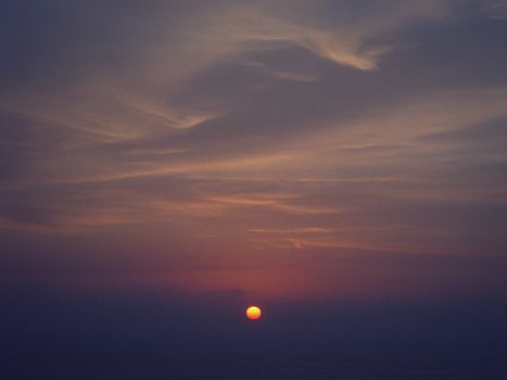 Beautiful sunset with striking clouds in a serene sky, showcasing nature's beauty.