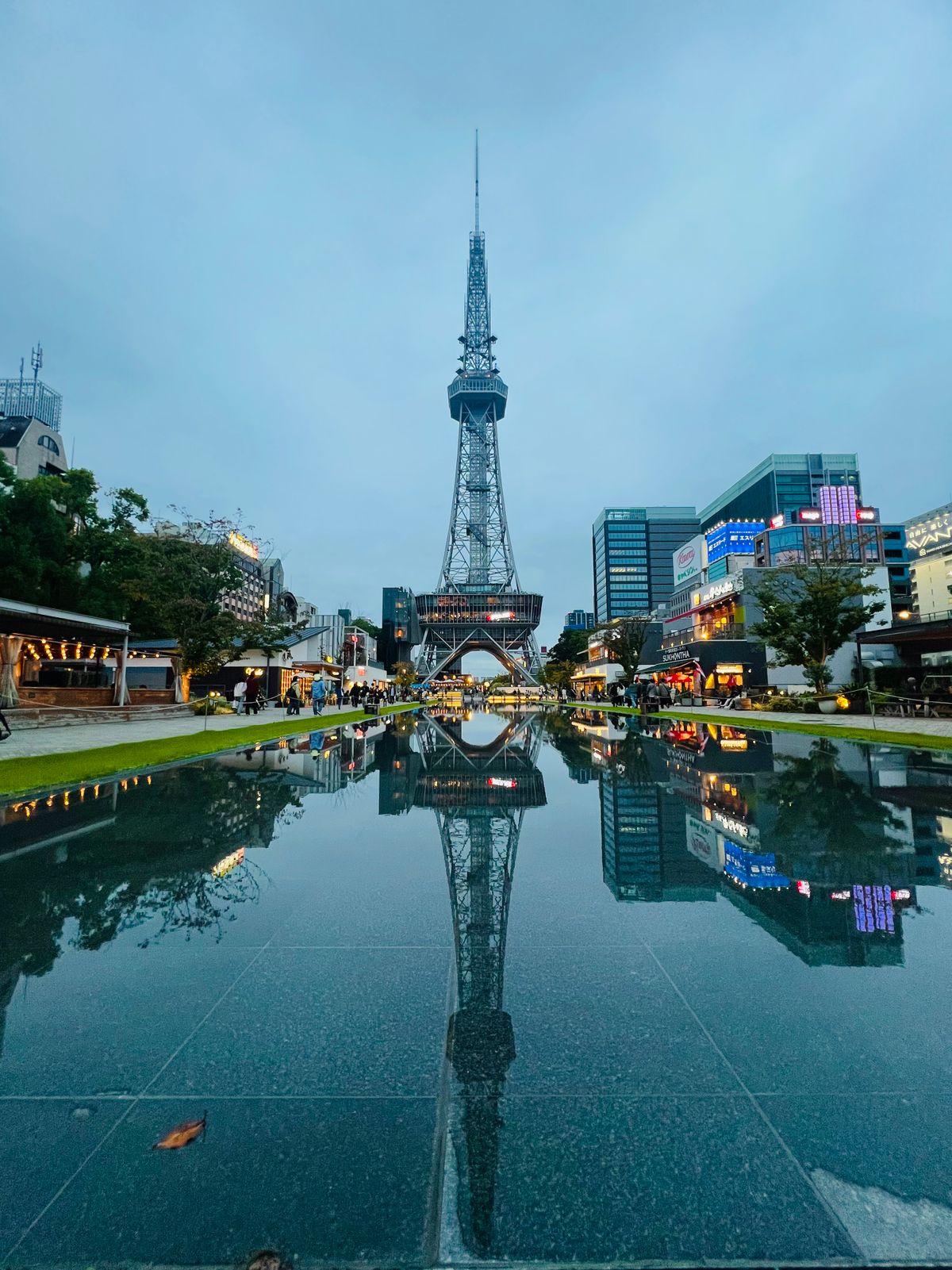 Nagoya TV Tower reflected in Hisaya Odori Park pond at dusk, Aichi Prefecture