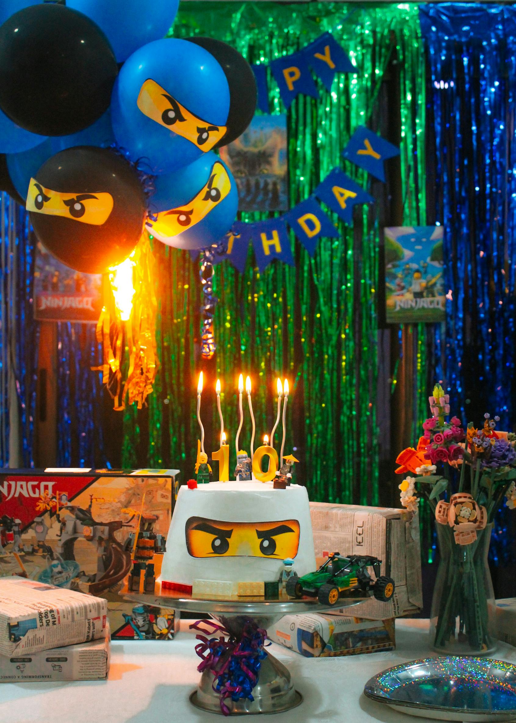 Colorful Ninjago themed birthday party with cake and decorations for a child's 10th birthday