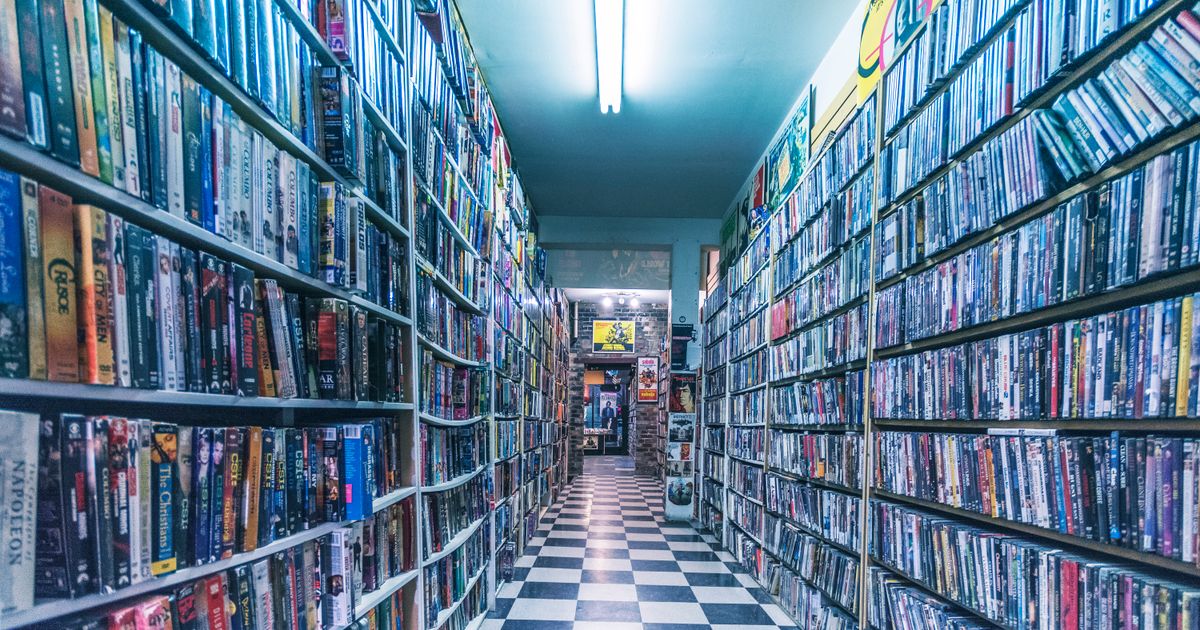Explore a nostalgic video store aisle filled with classic VHS tapes, capturing retro vibes.