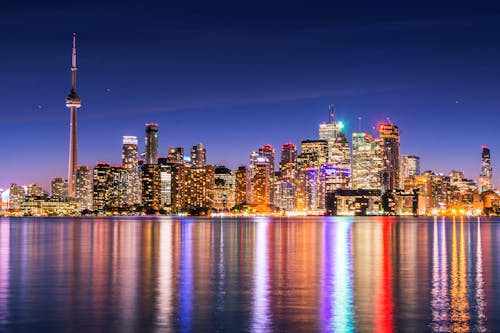 Free Skyline Photography of Buildings during Nighttime Stock Photo