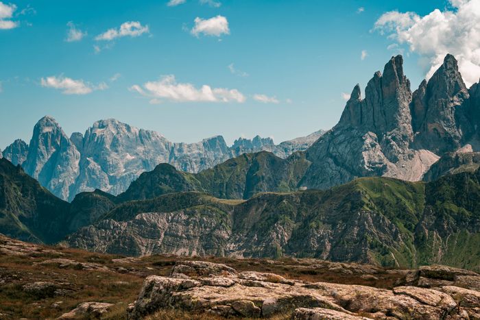 Rugged Dolomite peaks under a blue sky — photo by Cătălin Todosia on Pexels
