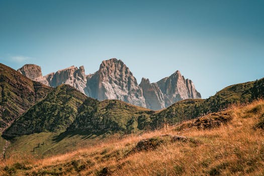 Breathtaking view of a rugged mountain range under clear summer skies.