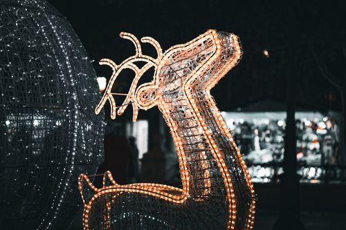 Free A festive reindeer decoration lit up with bright lights, creating a charming holiday ambiance. Stock Photo
