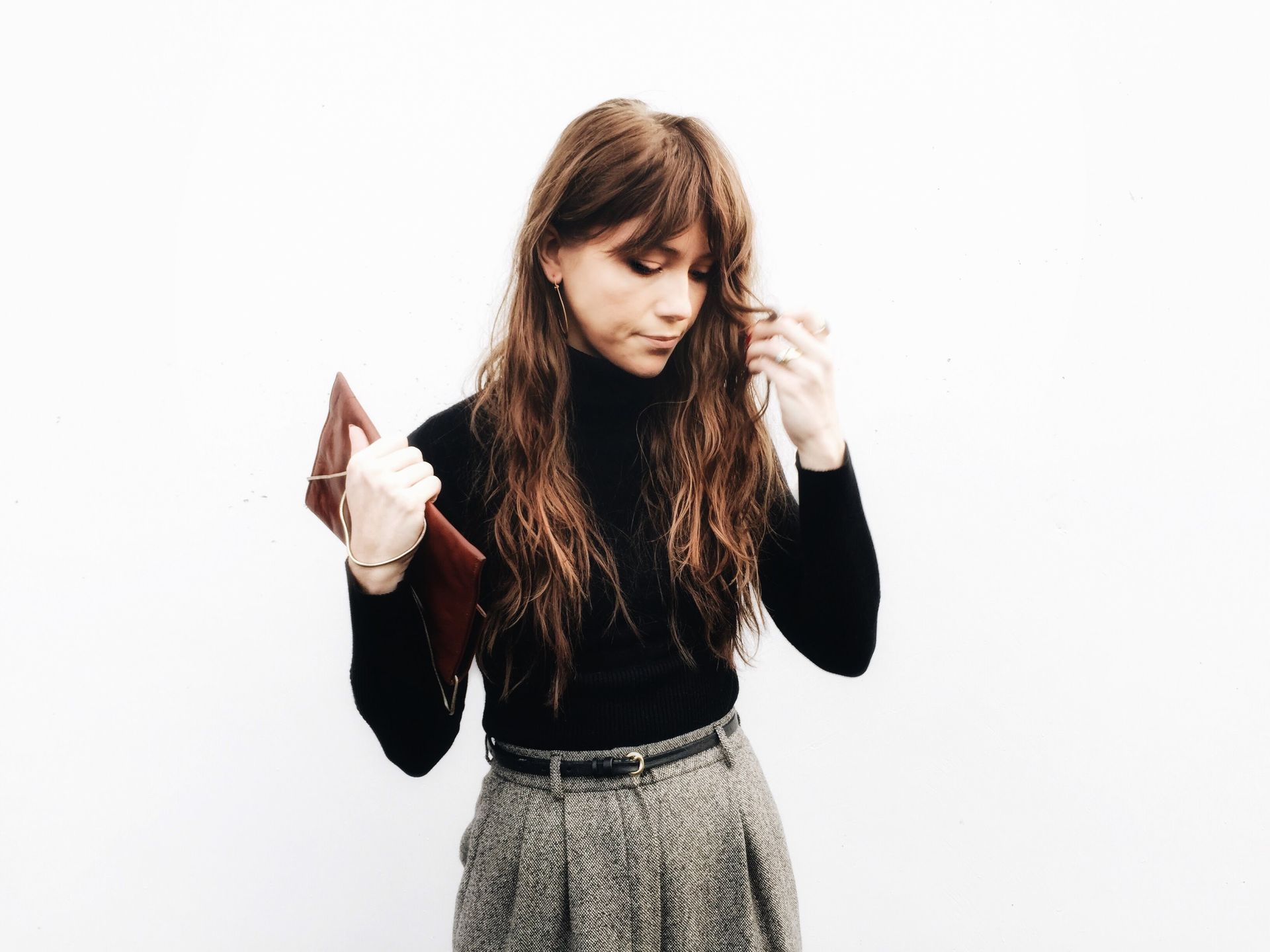 Modern elegance in Salem captured with chic urban fashion against a minimalist background.