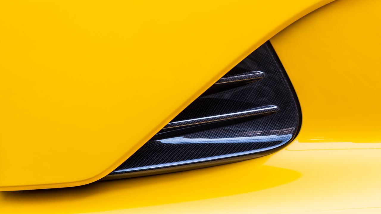 detailed view of a yellow supercar s carbon fiber vent design for slee