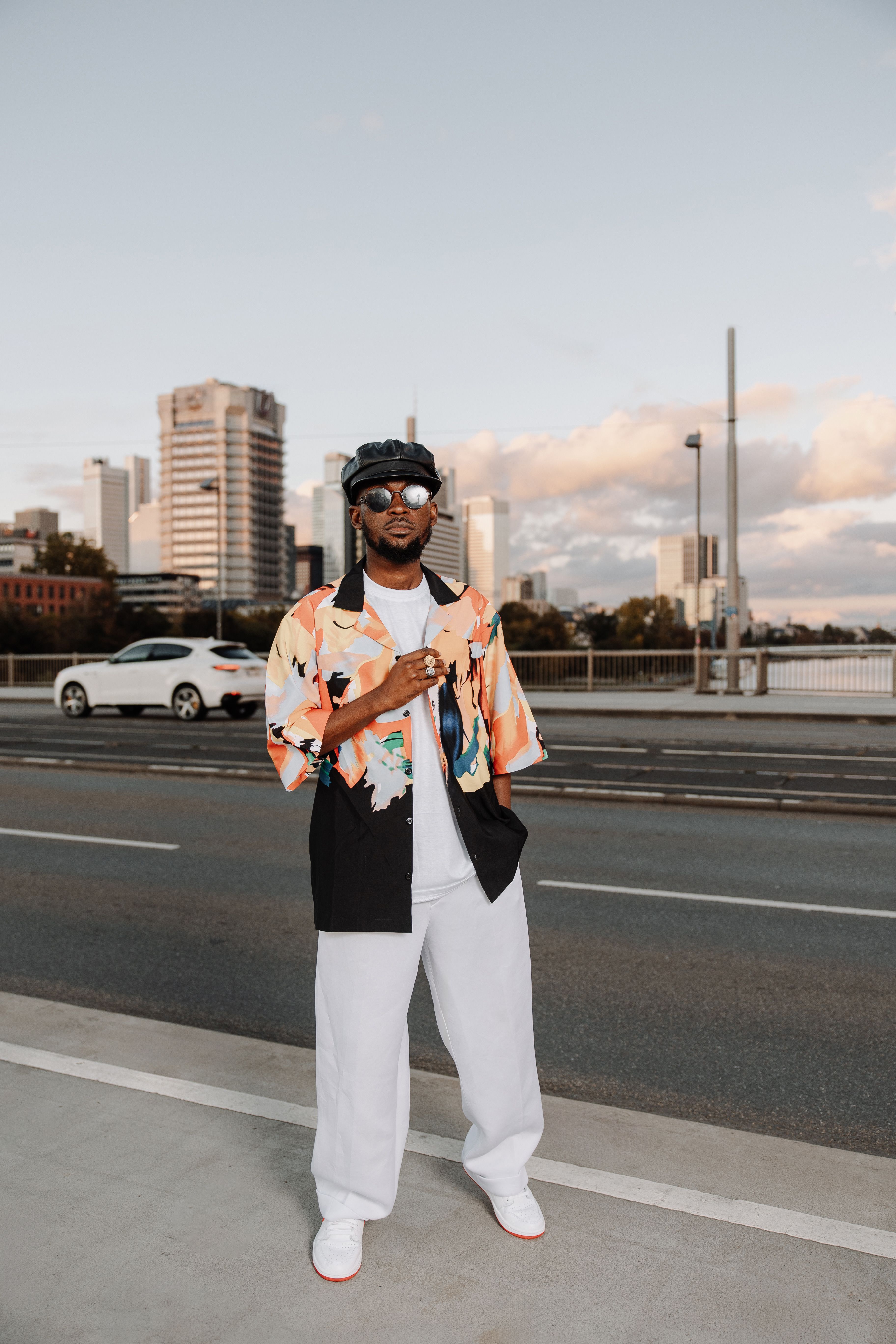 Stylish Man Posing Downtown with Cityscape · Free Stock Photo