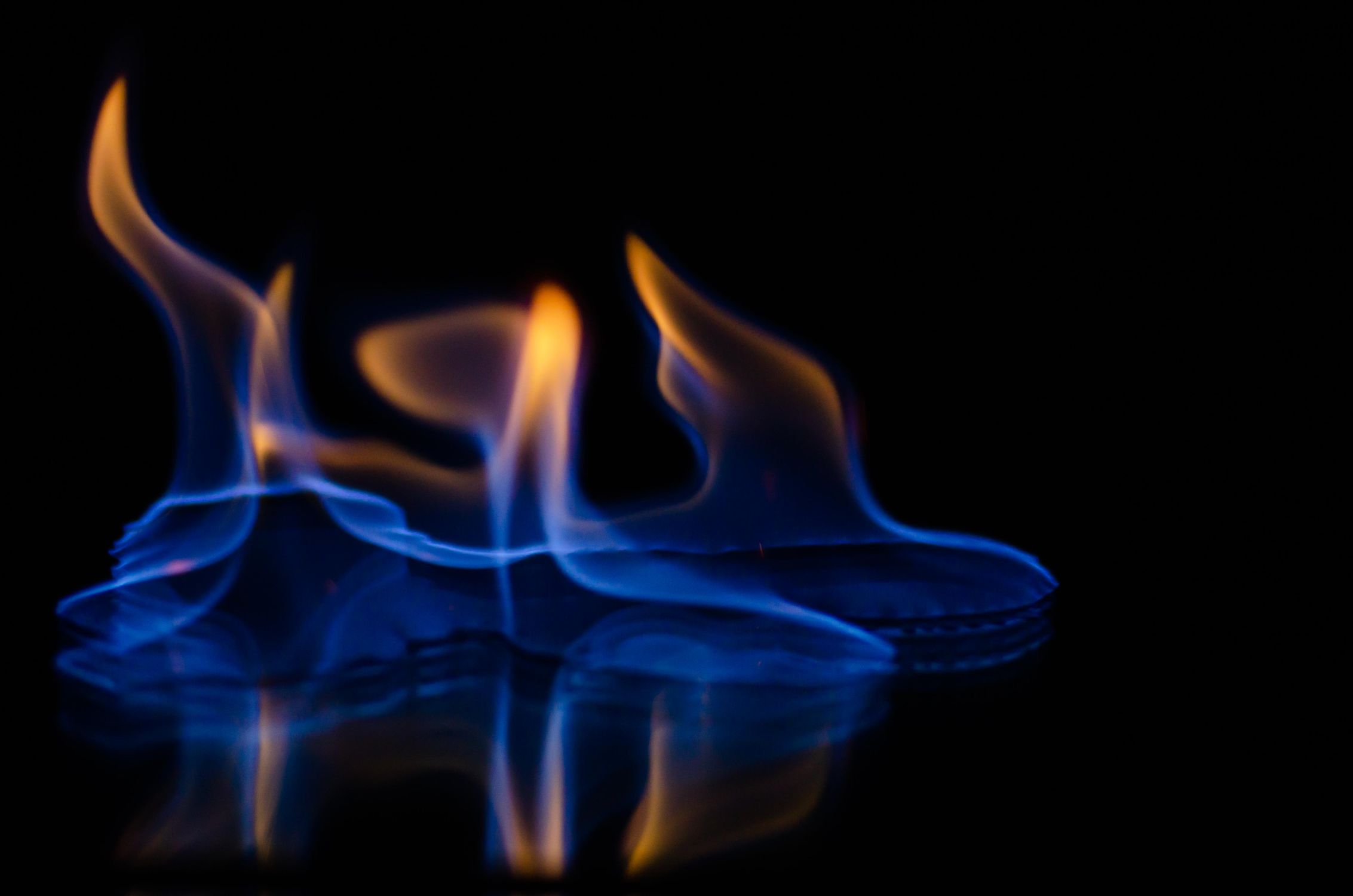 Blue and Orange Flames Against Black Background · Free Stock Photo