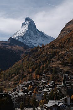 Captivating autumn landscape of Zermatt with the iconic Matterhorn peak in the background.