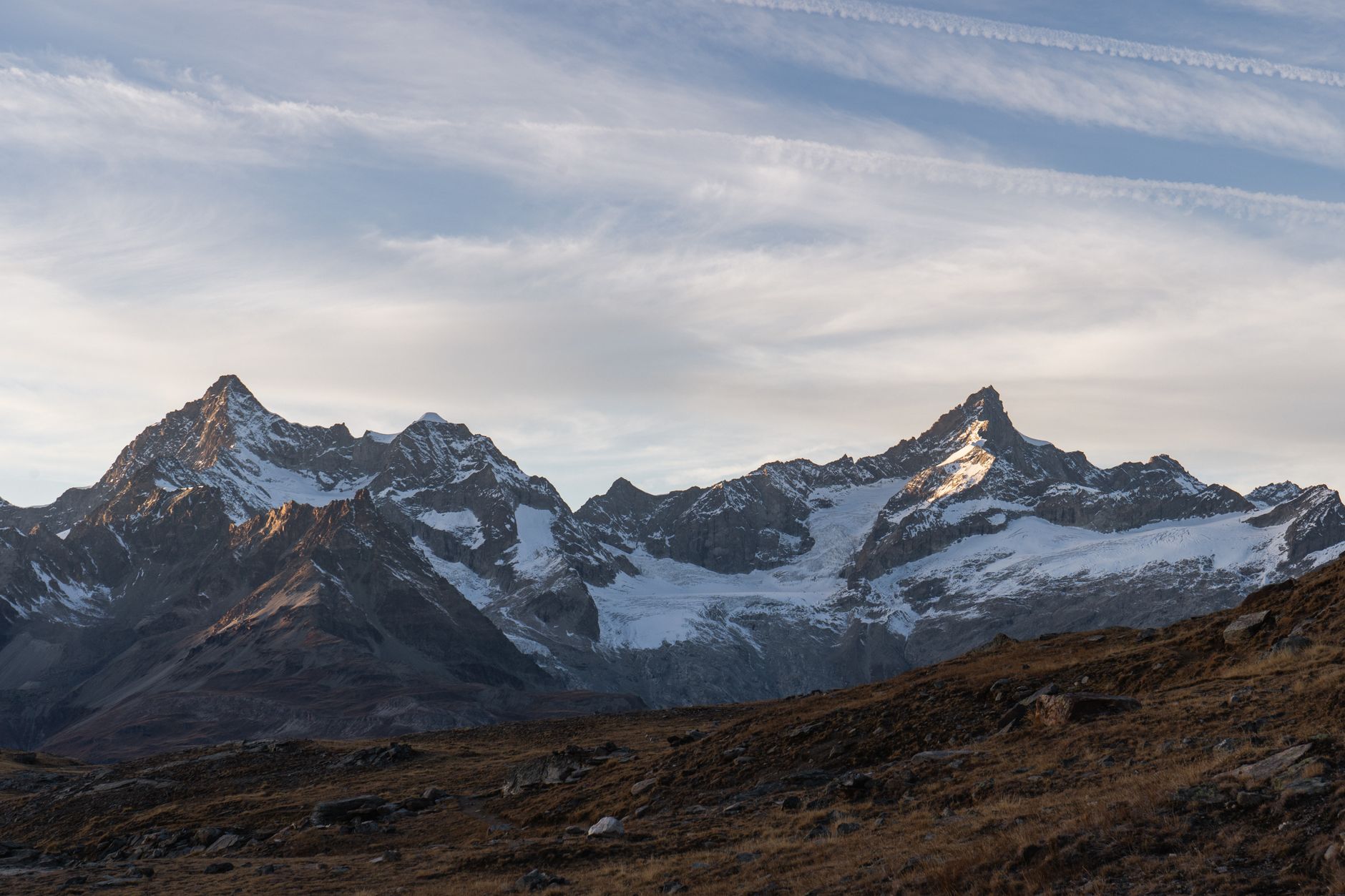 Stunning view of Zermatt mountains in Switzerland at sunrise with snow-capped peaks.