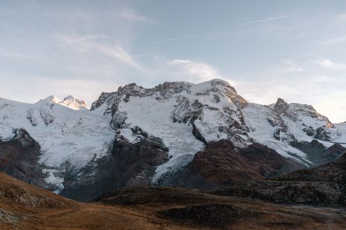 Free Snow-covered Alpine peaks in Zermatt, Switzerland during a clear day. Stock Photo