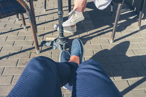 Person Sitting Near Sitting Woman