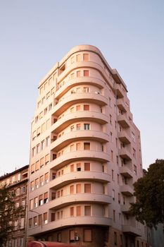 View of an Art Deco style building in Opatija, Croatia during sunset, showcasing its unique architectural features.