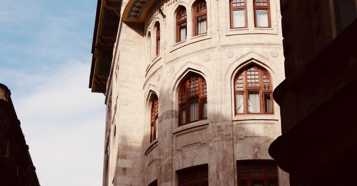 Building Windows Design Elegant Historical Building with Arched Windows · Free Stock Photo