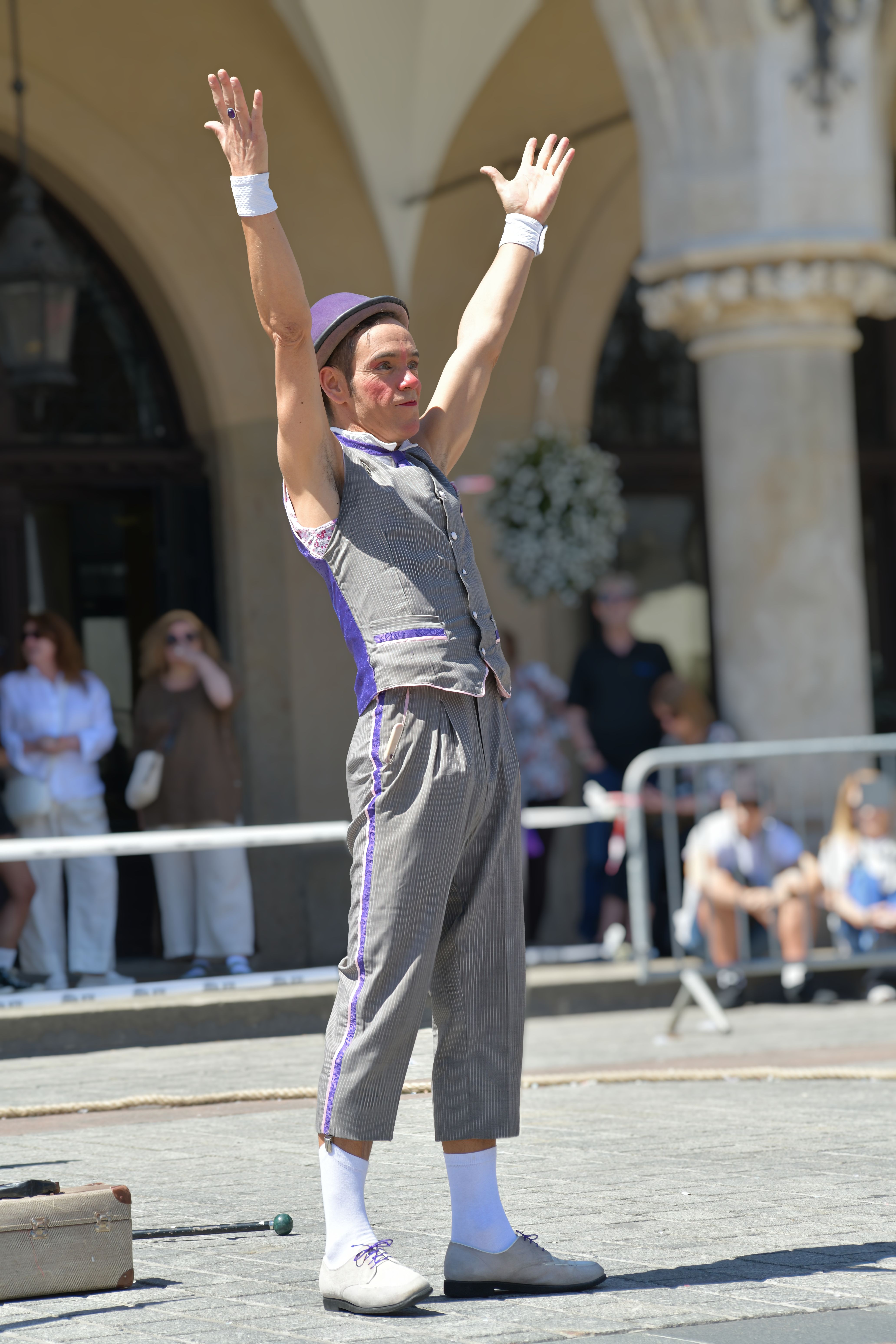 Street Performer Entertaining a Crowd Outdoors · Free Stock Photo